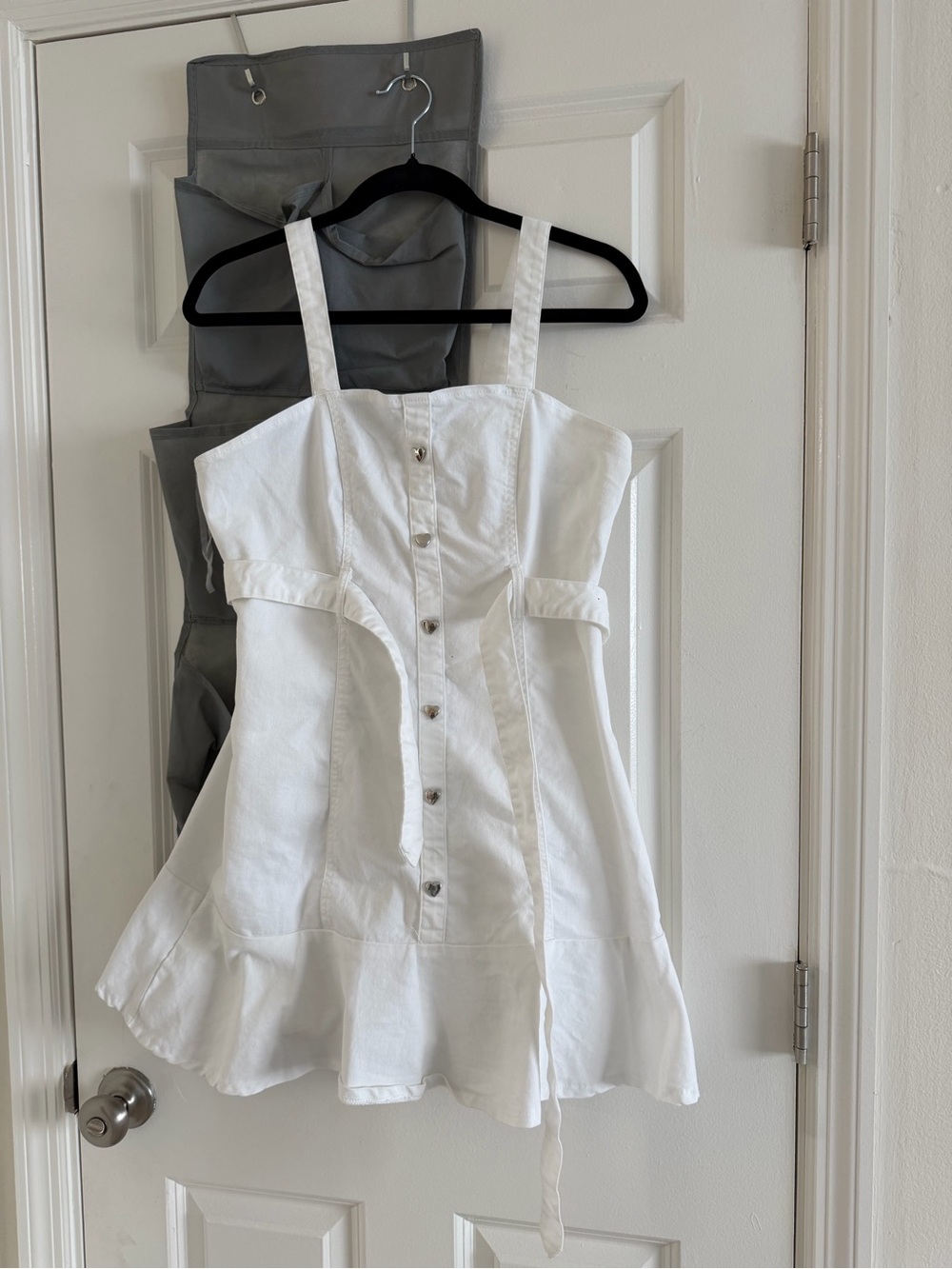 White Button-Front Sleeveless Top with Flared Hem